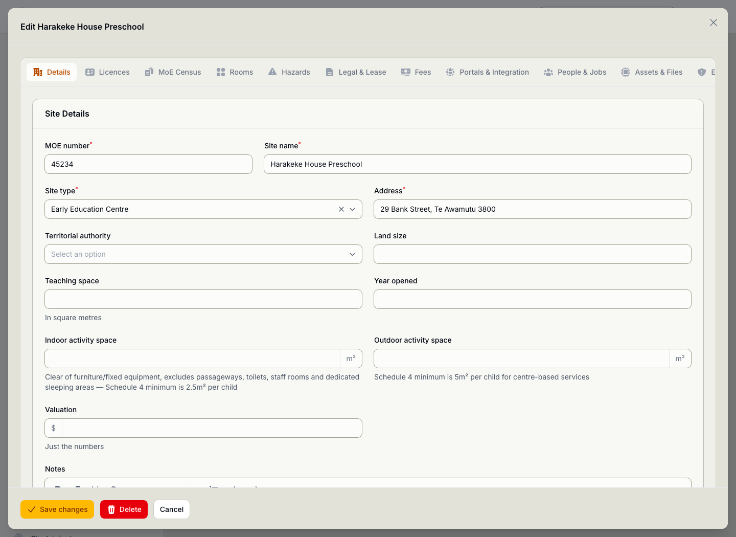 A site open for editing, showing its MoE number, address, service type and the licence conditions recorded against it.